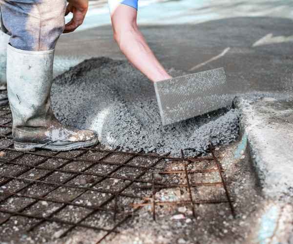 Concrete driveway installation with proper reinforcement and finishing in Irvine home